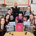 Blue Peter presenter and former St Bernadette's Primary pupil Abby Cook is pictured with the school's Digital Ambassadors and Catriona Martin, class teacher and digital coordinator.  (pic: Michael Gillen)