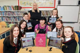 Blue Peter presenter and former St Bernadette's Primary pupil Abby Cook is pictured with the school's Digital Ambassadors and Catriona Martin, class teacher and digital coordinator.  (pic: Michael Gillen)