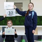 Magdalene, Lana with the winning Holy Family entry, and Vianne show off winning designs that are set to feature on the town’s three canal bridges.