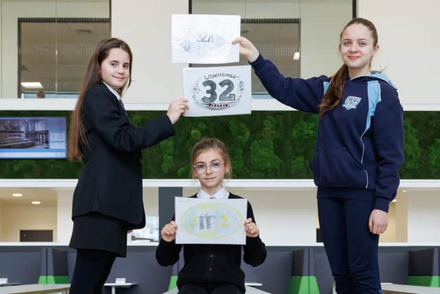 Magdalene, Lana with the winning Holy Family entry, and Vianne show off winning designs that are set to feature on the town’s three canal bridges.