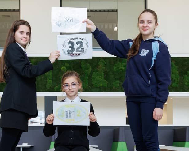 Magdalene, Lana with the winning Holy Family entry, and Vianne show off winning designs that are set to feature on the town’s three canal bridges.