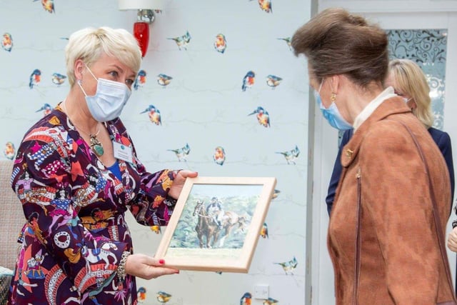 The Princess Royal is shown the painting of her by pupil Connor Draycott, 17. Pic: Ian McDiarmid
