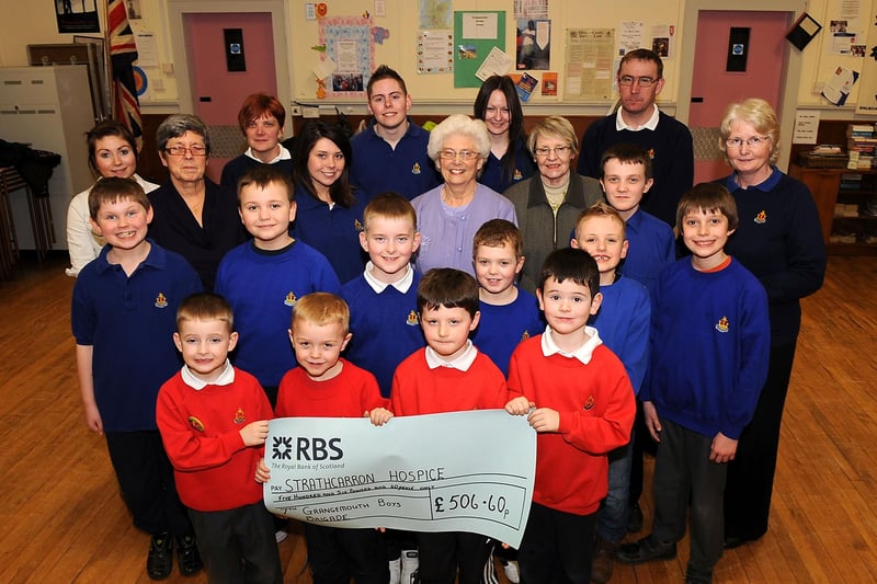 In 2011 members of 7th Grangemouth  Boys Brigade handed over a cheque for £506.60 cheque to Strathcarron Hospice. Pictured receiving the cheque are Grangemouth Friends of Strathcarron Hospice, Anne Fairlie, Helen Black and Sadie Mitchell.
