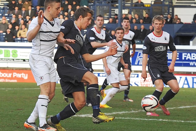 Jonathan Flynn puts the ball out in front of John Baird but gets a goal-kick