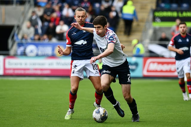 Aidan Nesbitt, who went off injured, battles with ex-Falkirk man Ryan Williamson