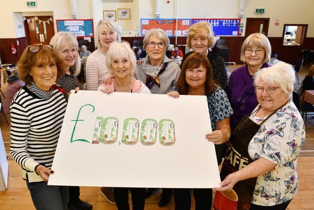 Polmont Snowdrop Community Cafe volunteers mark two years and £10,000 donated to charity: left to right, Helen Watson, Louisa McGrandles, Anna Rodden, Janice Morrison, Liz Graham, Rona Wearing, Alice Cumming, Grace Brown and Rosemary Taylor. Pic: Michael Gillen