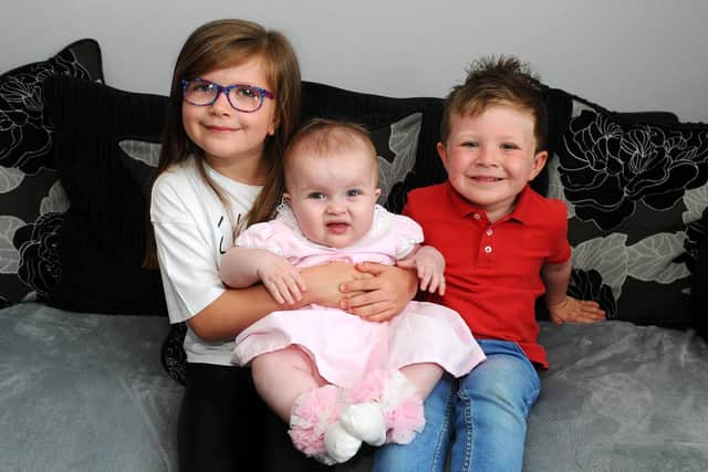 Mum says sister Ellie (7) and brother Owen (3) are "absolutely brilliant" with their wee sister Lily.  Pic: Michael Gillen.