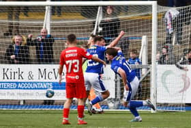 Kieran McKechnie and Cammy Logan wheel away to celebrate after Coll Donaldson fumbled the ball into his own net (Pictures by Michael Gillen)