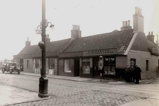 The corner of Main Street and Mungalhead Road, which leads up to the old estate of Merchiston, photographed in the mid-1930s