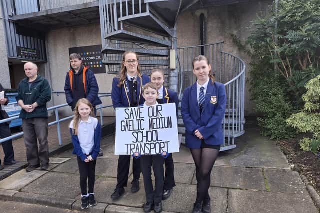 Pupils made their views known outside Falkirk Council as they protested over plans to cut transport for Gaelic medium pupils