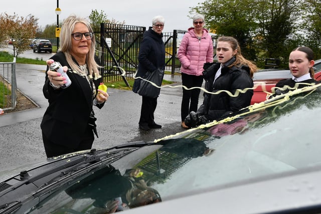Mrs Gallagher recruits some pupils to help her decorate Iain's car