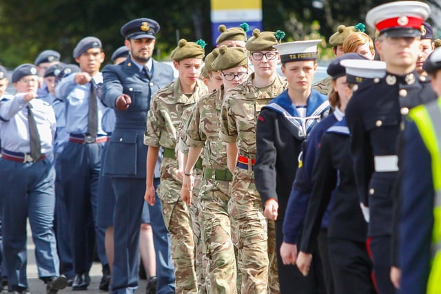 Young cadets from all three armed services march in the parade
