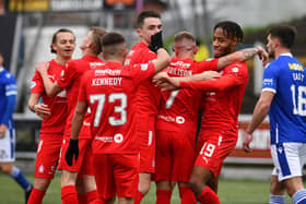 Rumarn Burrell celebrates his second goal with his Falkirk team-mates