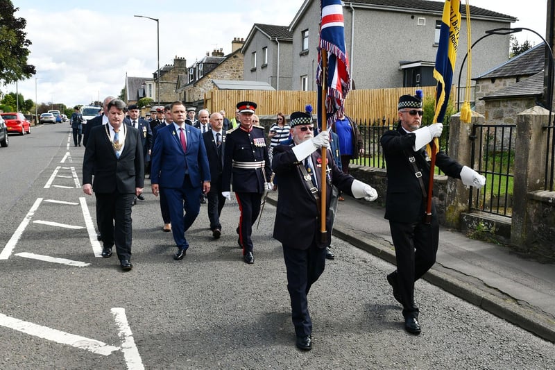 Standard bearers ahead of the guest speakers in the parade.