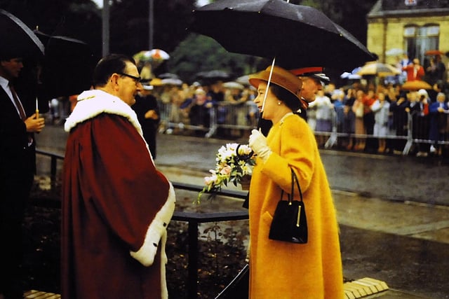 Despite the rain, crowds lined the street to greet The Queen.