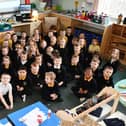 P1 pupils from P1BC, P2/1 and P1T classes at Maddiston Primary in their new learning space at Wallacestone Primary. Pic: Michael Gillen