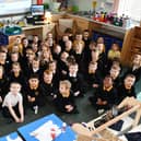 P1 pupils from P1BC, P2/1 and P1T classes at Maddiston Primary in their new learning space at Wallacestone Primary. Pic: Michael Gillen