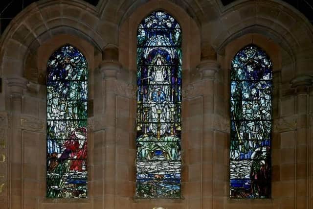 Stenhouse and Carron Parish Church's stained glass windows.
