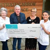 Malky Finlayson is joined by auxiliary nurse Yvonne Edwards, fundraising administrator Diane Harrison ans auxiliary nurse Caragh Walker as he presents £5440 cheque to Strathcarron Hospice
(Picture: Michael Gillen, National World)