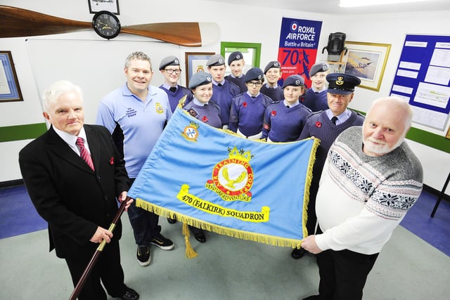 470 Falkirk Squadron show off their new Standard in 2015. Pictured from left to right are Cllr Billy Buchanan, Pilot Officer Marc Esson, Flying Officer Aubin Bryce and Cllr John McLuckie.