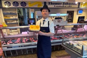 A member of the Thomas Johnston team with the winning steak pie. Pic: Contributed