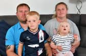 The parents of Sophie Mitchell were shocked to learn of the long wait for the procedure, pictured: dad Paul, mum Gillian, brother Freddie, five, and Sophie, three. Pic: Michael Gillen