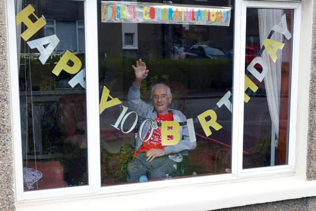 Life-long Falkirk fan Malcolm Finlayson is marking his 100th birthday at home. Picture: Michael Gillen.