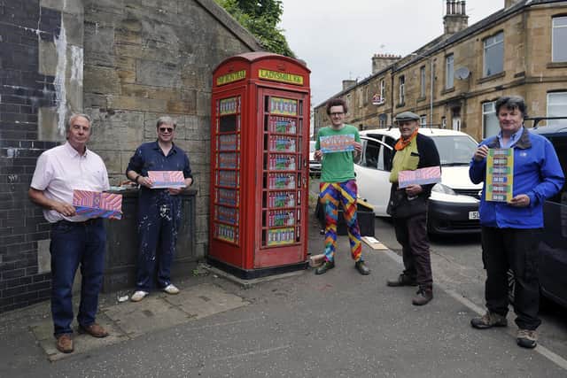 Edinburgh-based artist Richard Duffy with Falkirk Made Friends members beside an old K6 phone box at Ladysmill Bridge, Falkirk which was made in Carron Ironworks. Pictured with the phone box are Bill Paterson, FMF member; John, a fellow FMF member; artist, Richard Duffy; Duncan Comrie, FMF secretary; and Robert Bissett, FMF chairman. Picture: Michael Gillen.