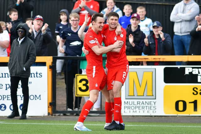 Liam Henderson celebrates with Falkirk teammate Ryan Williamson after they combined for two goals
