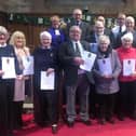 Reverend Iain Greensheilds, Moderator of the General Assembly of the Church of Scotland, with the long service award recipients