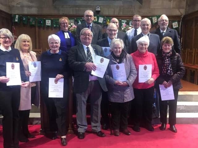 Reverend Iain Greensheilds, Moderator of the General Assembly of the Church of Scotland, with the long service award recipients