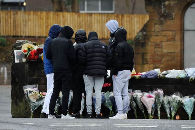 Heartbroken friends gathered at the floral tributes to teenager Harley Smith,16, at Laurieston Parish Church in the days after his tragic death