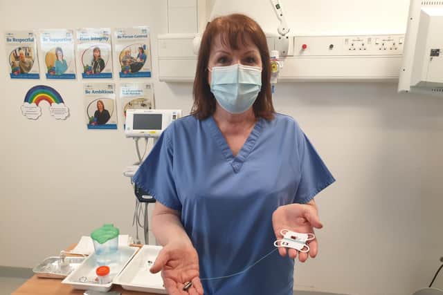 Forth Valley Royal Hospital nurse Julie MacDonald with the Cytosponge device