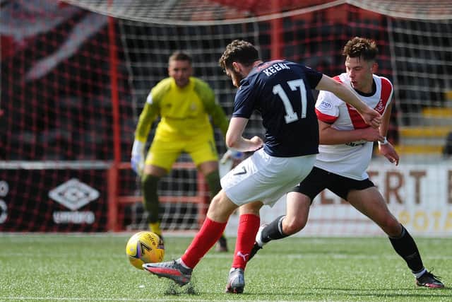 Aidan Keena lifts the ball delightfully over Airdrieonians 'keeper Max Currie for Falkirk's second goal on Saturday (picture by Michael Gillen)