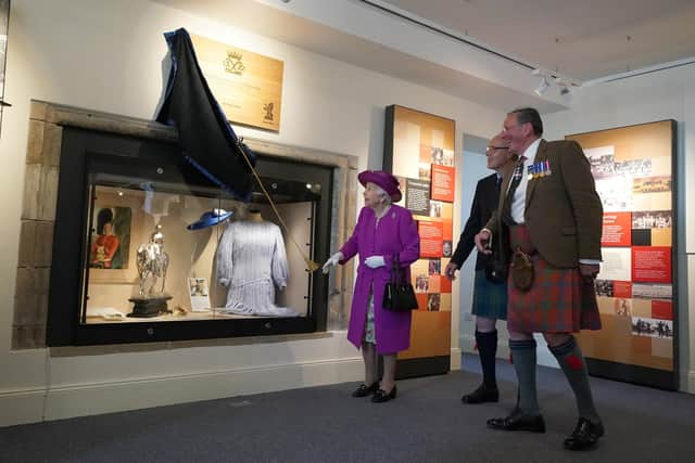 HM The Queen unveils a plaque to open the new Argyll and Sutherland Highlanders Museum at Stirling Castle.Pic: Andrew Milligan - Pool/Getty Images