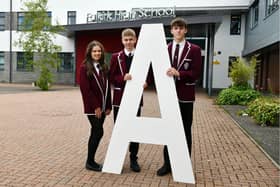 Falkirk High School pupils celebrating success. Pictured: Tamsin Gold, 17, five A Highers; Daniel Gray, 16, seven A National 5s; and Finlay Morrison, 16, five A Highers. Pic: Michael Gillen.