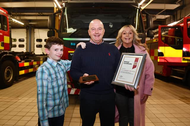 Allan Hardy was joined by son Lewis and wife Michelle at his leaving ceremony at Falkirk Fire Station. Picture: Michael Gillen.
