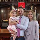 Reverend Andrew Brown at Craigmailen Church with his wife and daughter.