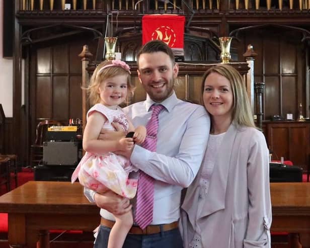 Reverend Andrew Brown at Craigmailen Church with his wife and daughter.