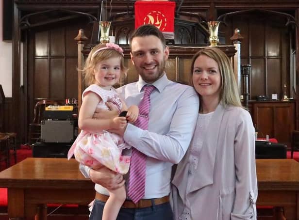 Reverend Andrew Brown at Craigmailen Church with his wife and daughter.