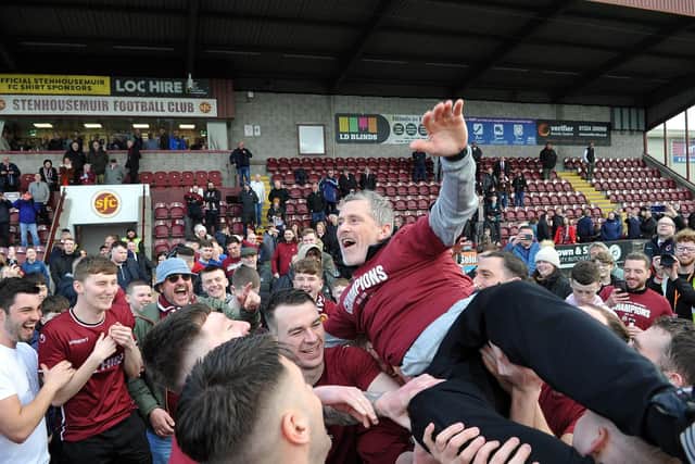 Gaffer Gary Naysmith celebrates with the Stenhousmuir supporters and players after the 0-0 draw with East Fife at Ochilview which sealed the League Two title (Photo: Michael Gillen)