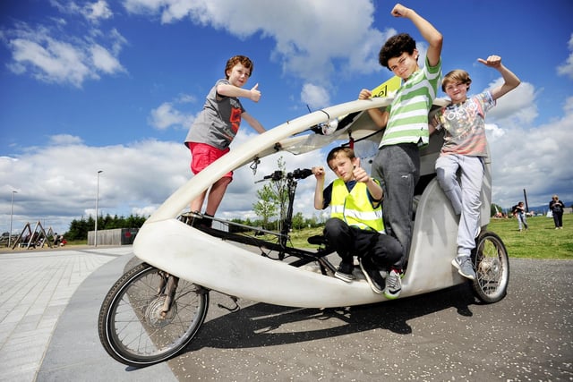 Ynyr Liddell (13), Ben Reid (12), Adam Mansouri (12) and Danny Thomson (13) on a rickshaw at Falkirk Community Trust's Summer Cycle event in 2015.