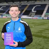 Craig McGuffie with his award (Photo: Roddy MacKenzie/Final Whistle Media)
