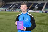 Craig McGuffie with his award (Photo: Roddy MacKenzie/Final Whistle Media)