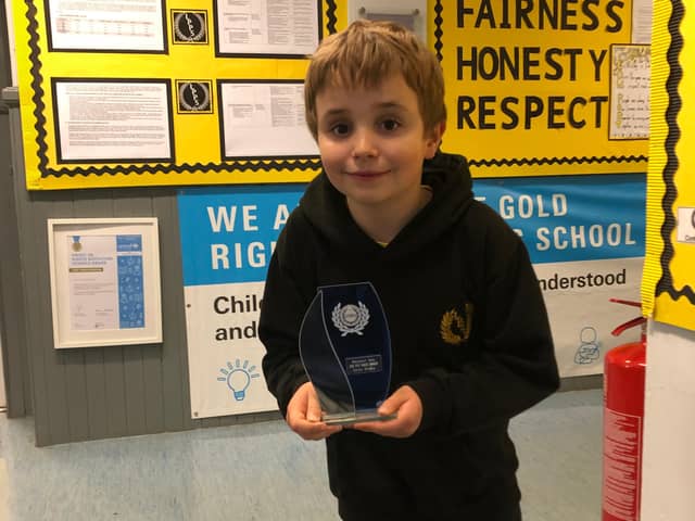 Low Port Primary pupil Quinn Brodie with his award.