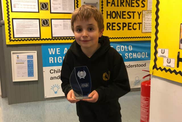 Low Port Primary pupil Quinn Brodie with his award.
