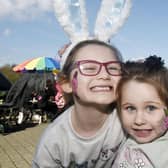 Holly Aitcheson, 7, and sister Rosie, 3, having fun at facepainting.