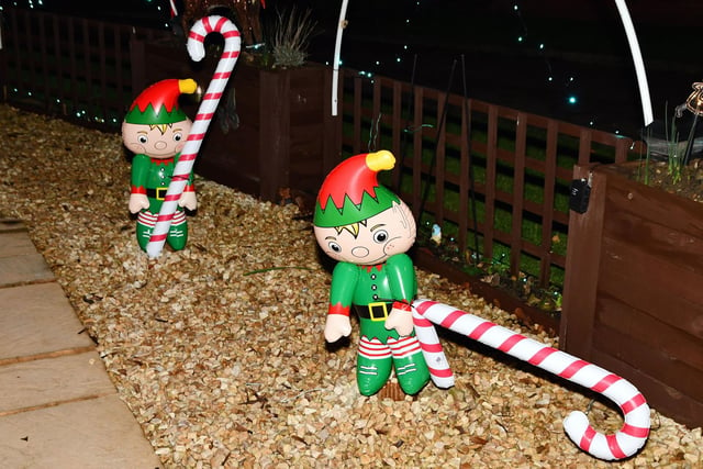 The elves brave the Miller Lights Display without sunglasses