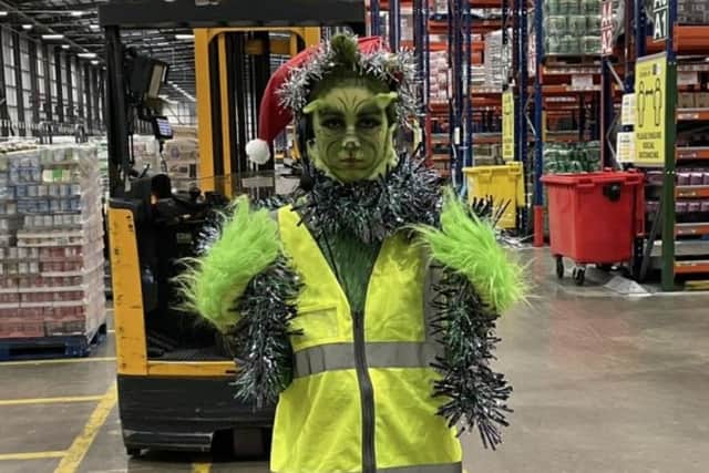 Asda Grangemouth warehouse worker Isla Fairfield claimed first prize in the supermarket's festive fancy dress contest after transforming herself into the Grinch. Contributed.