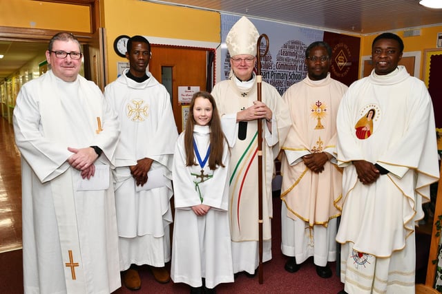 Left to right, Canon Kenneth Owens, former pupil; Father Emanuel Ndukwu, former parish priest;  Hannah Paterson;  Archbishop Leo Cushley; Father Francis Ututo, former parish priest;  and Father Ben Umeohana, current parish priest.